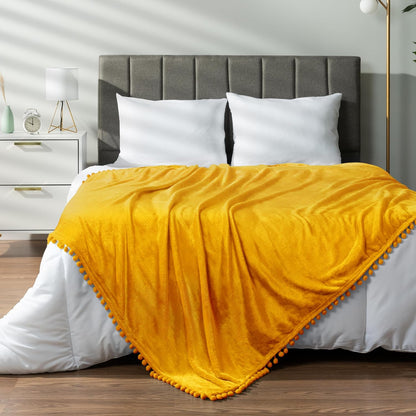 PAVILIA Fleece Throw Blanket for Couch with Pom Pom Fringe, Mustard Yellow, Soft Cozy Fuzzy Flannel Blanket for Sofa Bed, Lightweight Plush All Season Throw, 50x60 Inches