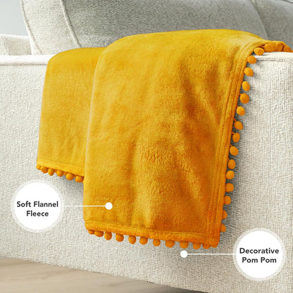 PAVILIA Fleece Throw Blanket for Couch with Pom Pom Fringe, Mustard Yellow, Soft Cozy Fuzzy Flannel Blanket for Sofa Bed, Lightweight Plush All Season Throw, 50x60 Inches