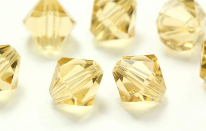 100pcs Adabele Austrian 4mm (0.16 Inch) Faceted Bicone Crystal Beads Golden Yellow Champagne Compatible with Swarovski Crystals 5301/5328